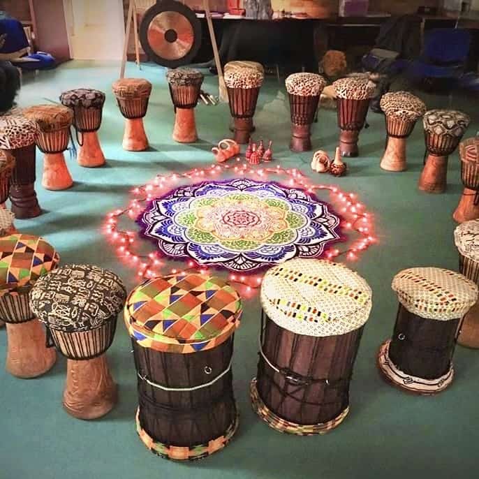 Circle of African drums ready for a Primal Sound community drumming session