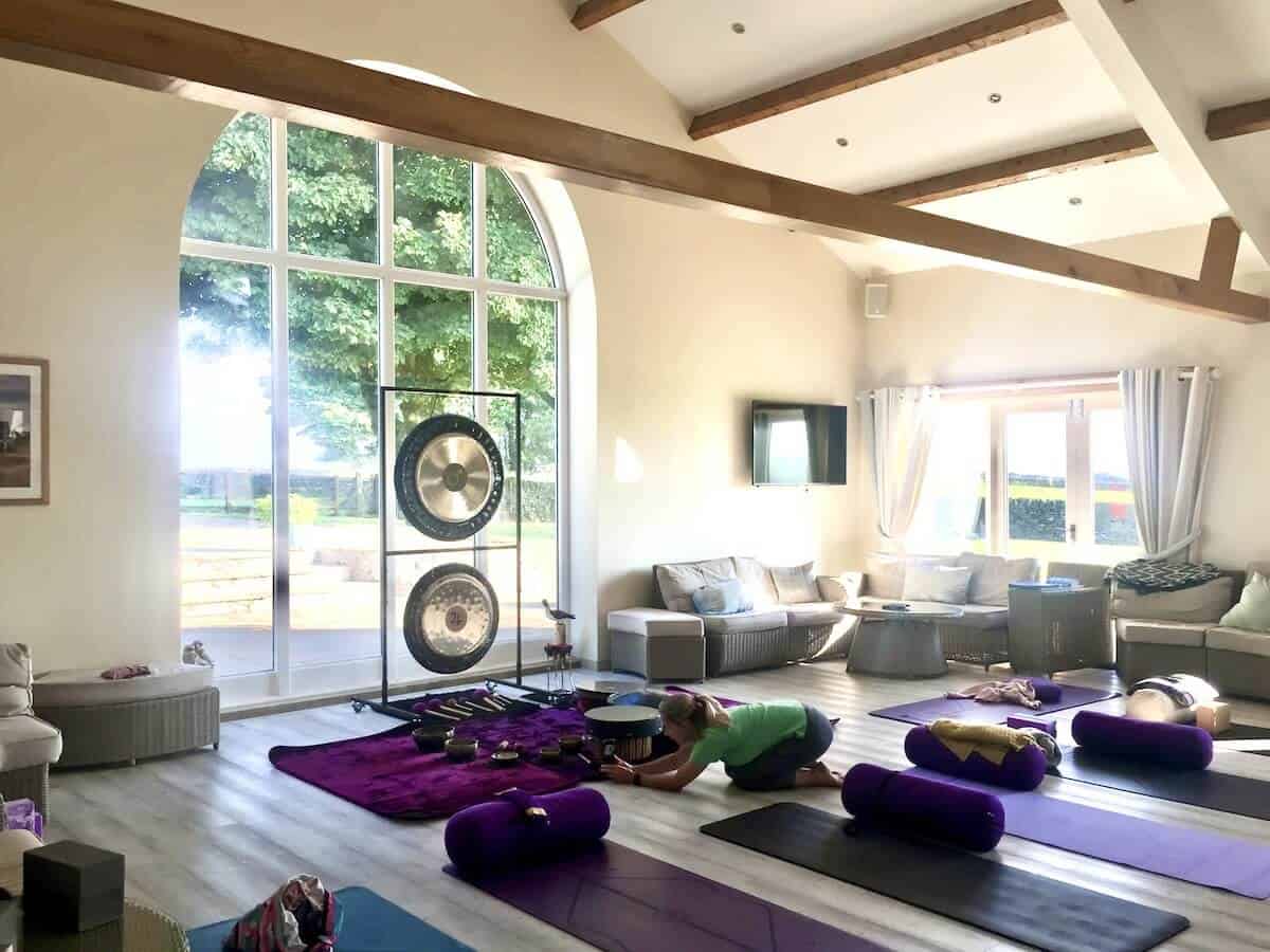 Soundbath Relaxation Session - Primal Sound Soundbath relaxation session setup with gongs, mats, and cushions – Primal Sound wellbeing workshop in the UK.